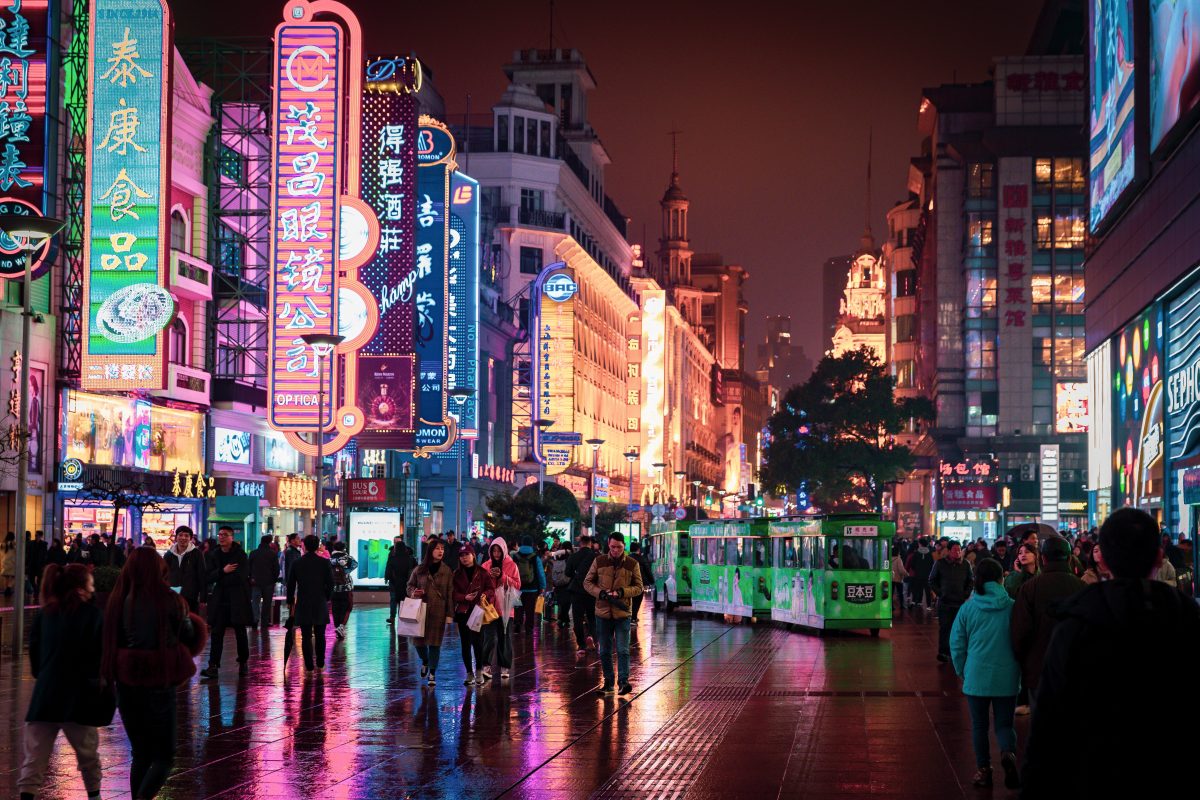 Shopping crowd at Nanjing Road, Shanghai’s premier pedestrian retail arcade. There are bright neon lights attached to the buildings Shopping crowd at Nanjing Road, Shanghai’s premier pedestrian retail arcade. There are bright neon lights attached to the buildings