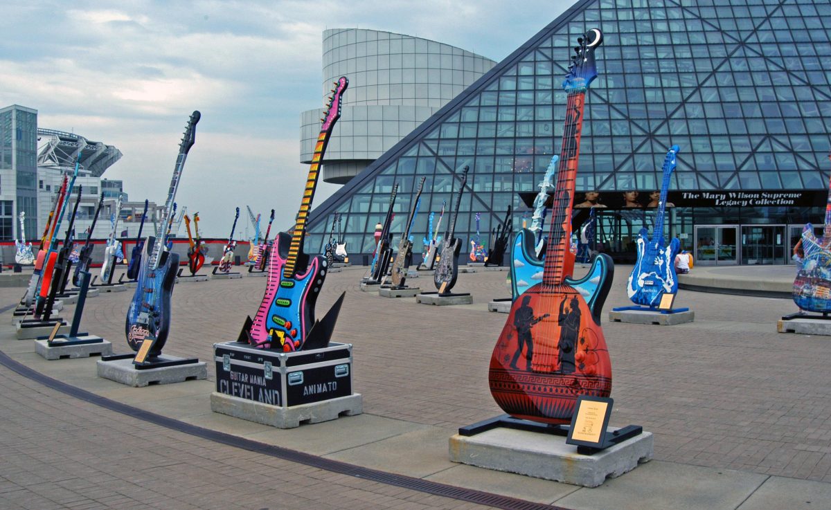 Main entrance to Cleveland’s Rock and Roll Hall of Fame with large colourful guitars on display