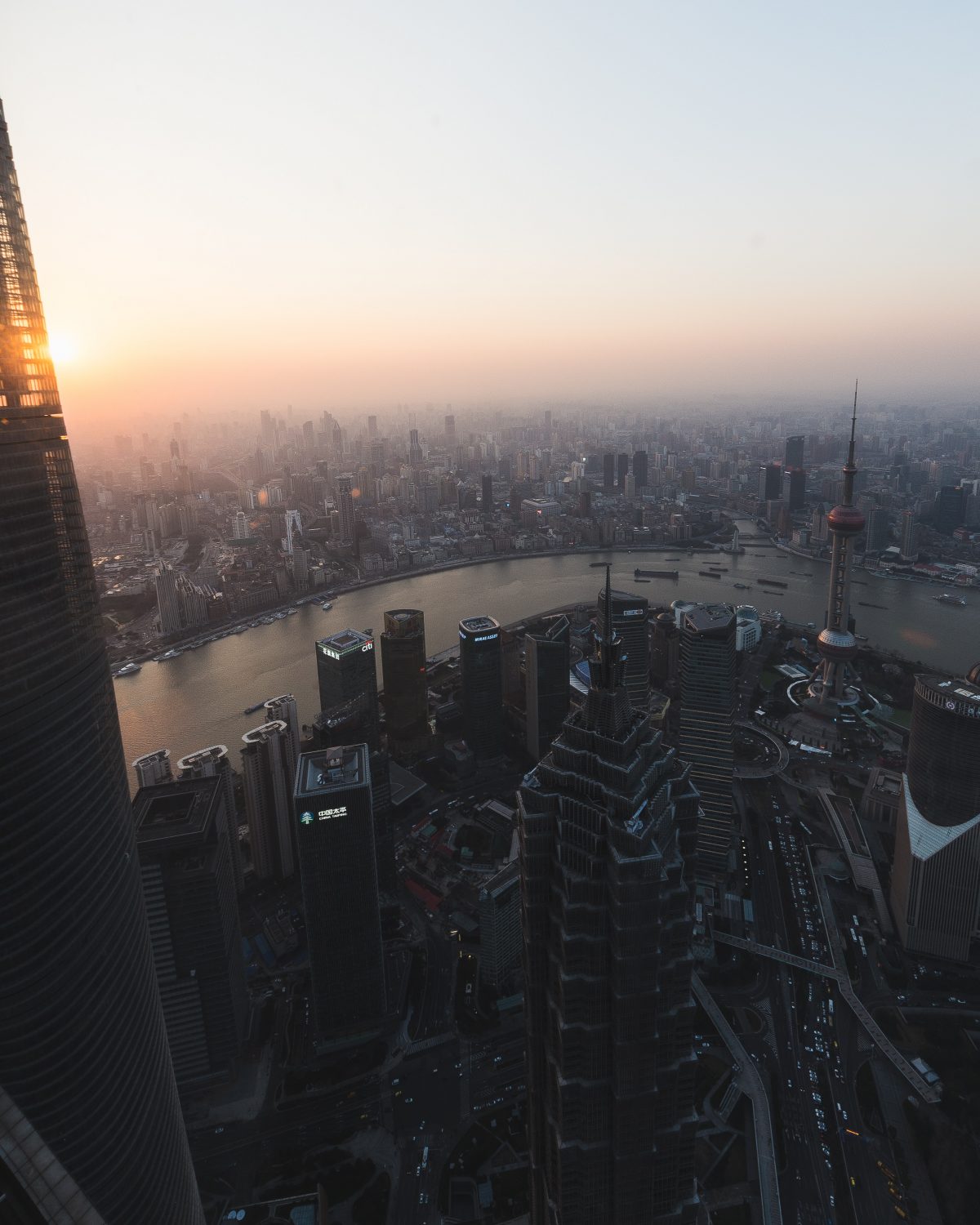 Panoramic view of Shanghai city from the Shanghai World Financial Centre in the evening sun Panoramic view of Shanghai city from the Shanghai World Financial Centre in the evening sun