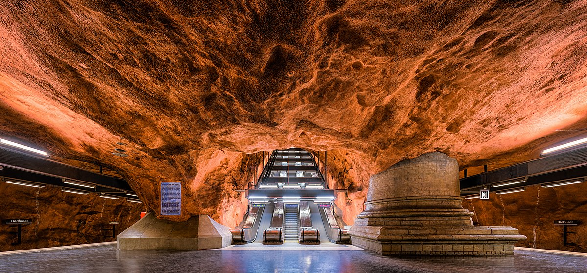 Stockholm Metro Station, beautiful orange rock ceiling over escalators Stockholm Metro Station, beautiful orange rock ceiling over escalators