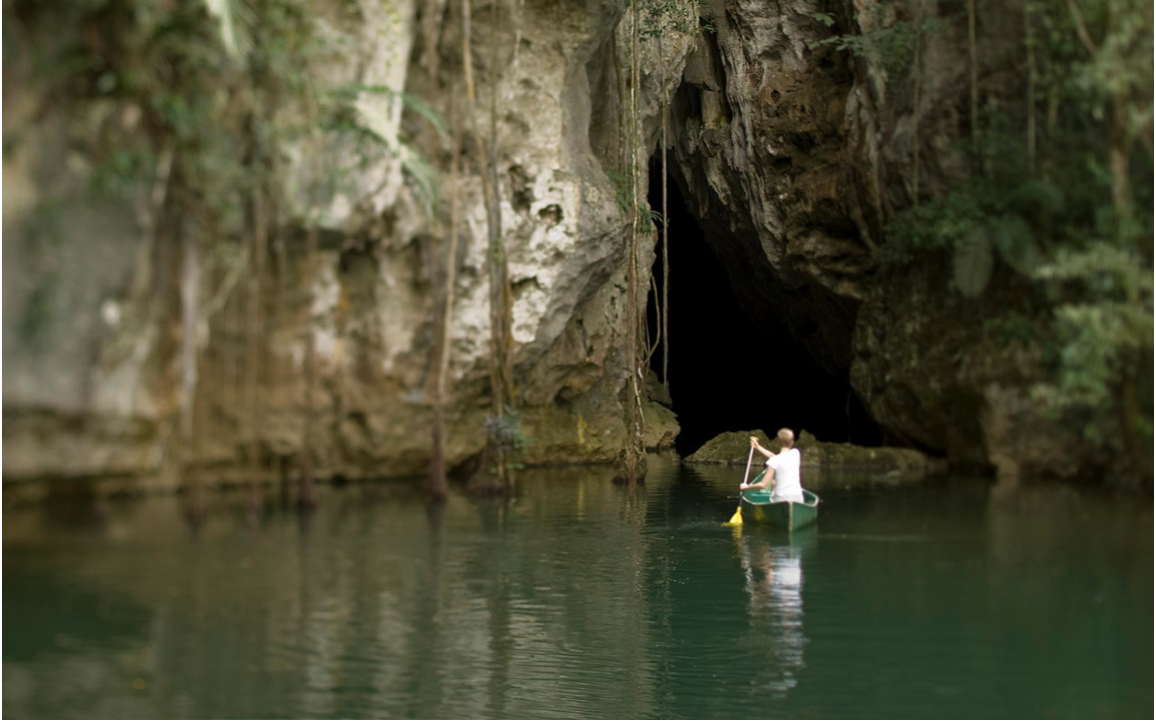 The Barton Creek Cave gives access to the breathtaking view that the Maya Mountains on Barton Creek offers