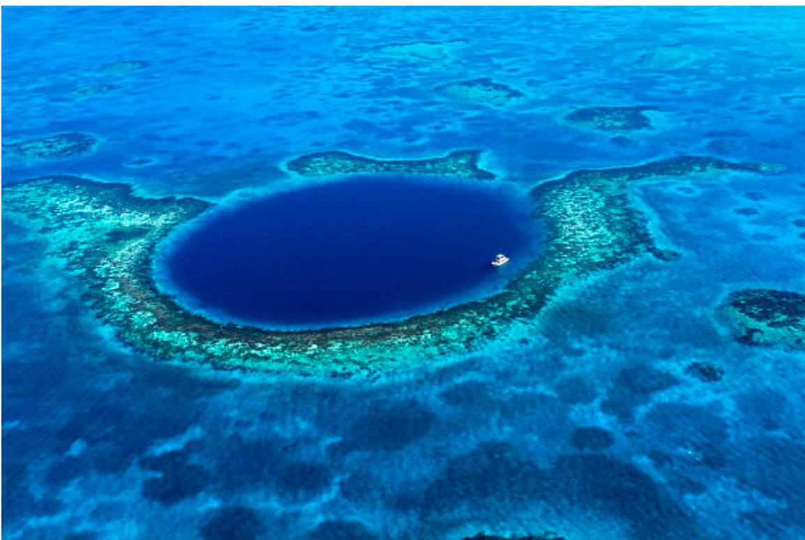 Divers from all over the world swim in The Great Blue Hole’s crystalline waters to meet the diverse sea life below