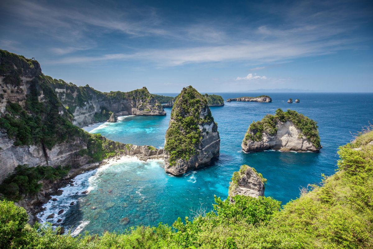 Aerial view of the small island of Nusa Batumategan and Nusa Batupadasan Island from the Atuh Rija Lima shrine on Nusa Penida Island near Bali, Indonesia.