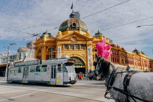 Panoramic view of Flinders street with tram passing by, Melbourne