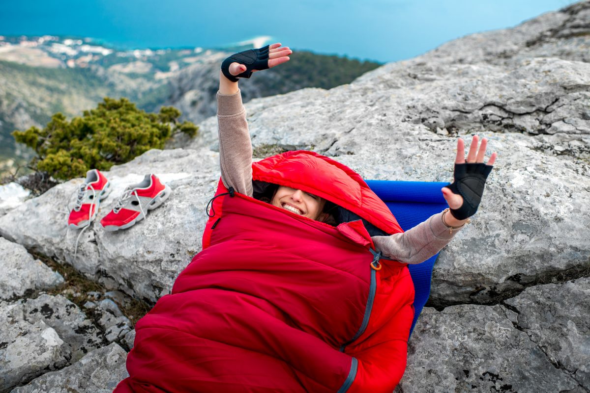 Woman in sleeping bag on the mountain Sleeping bags for great travel