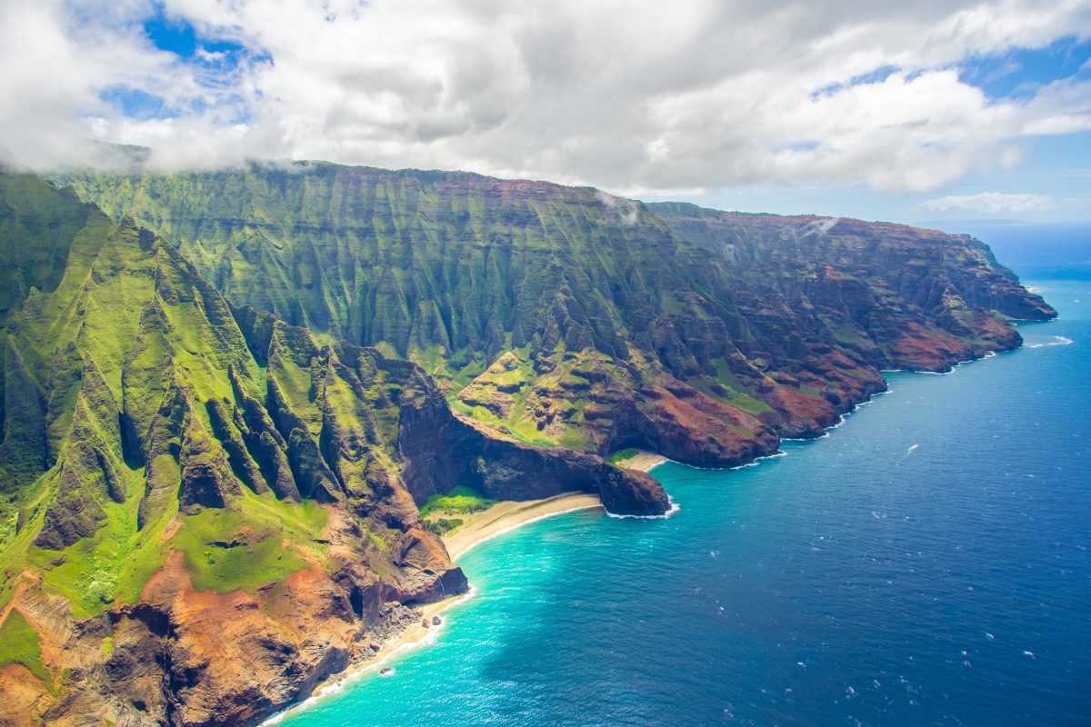 MAIN Troy Squillaci on pexels mountain range and a beach