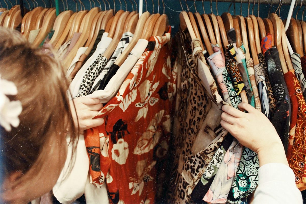 Woman browsing clothing at shop