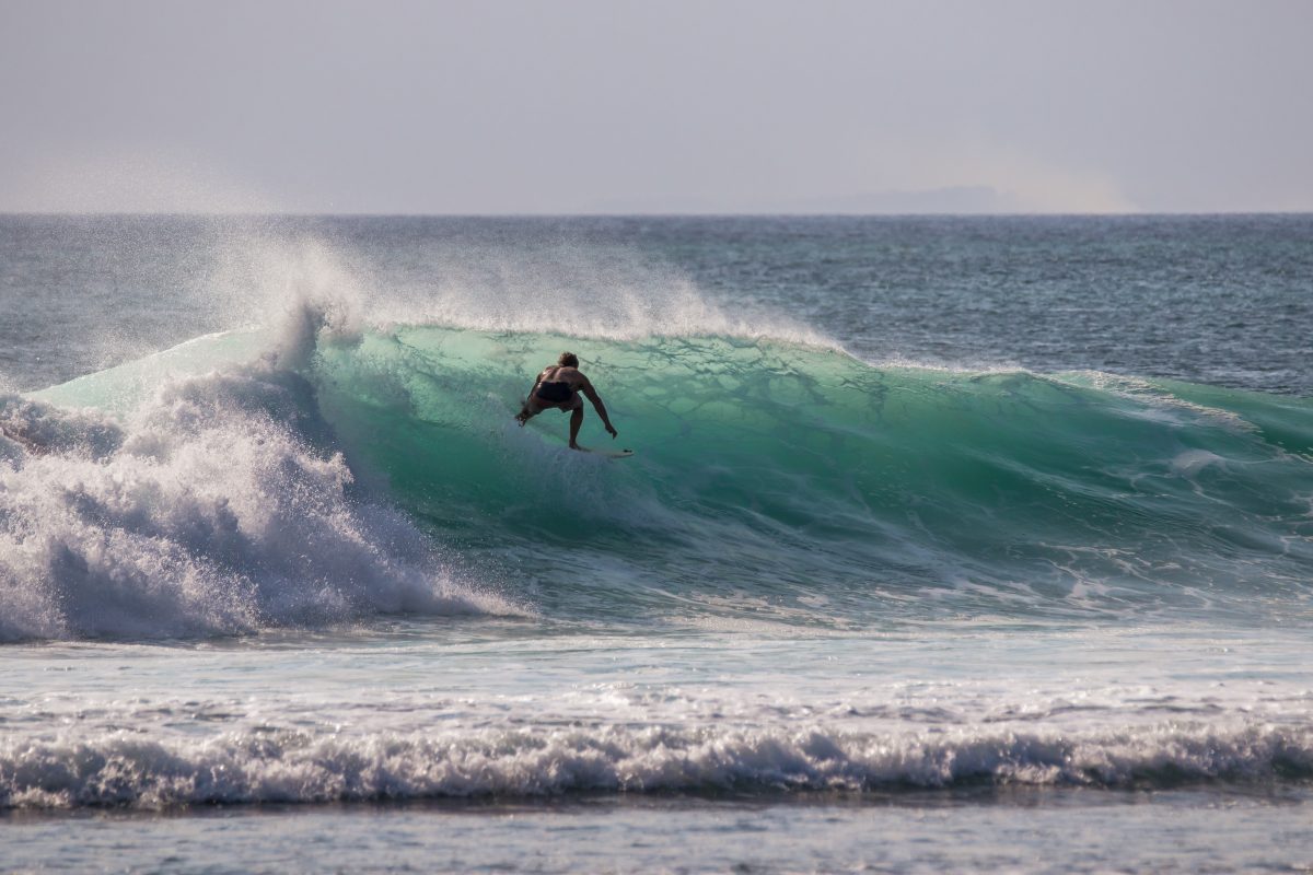 Surfing at padang padang beach Bali