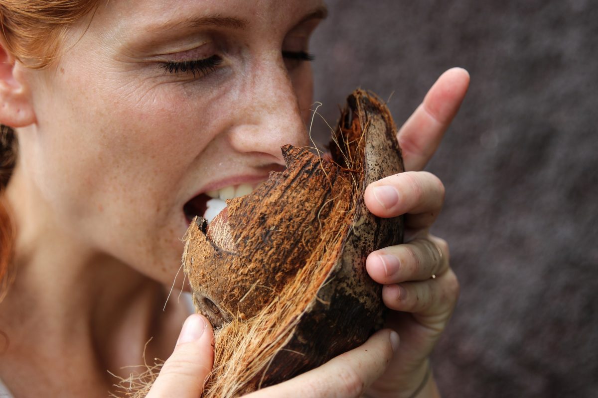 Woman enjoying a coconut Woman enjoying a coconut