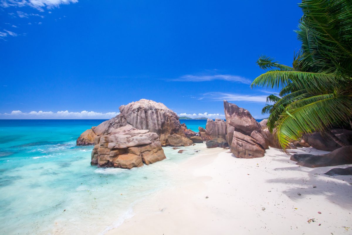 rock formation with white sand beach in Seychelles