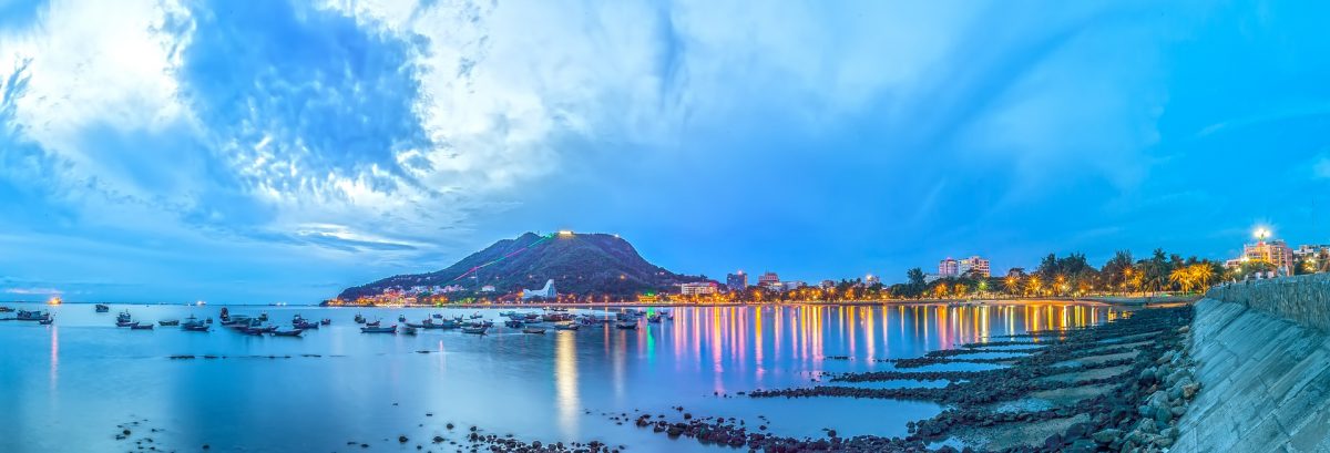 A panoramic view of the brightly lit port city of Vung Tau, Vietnam