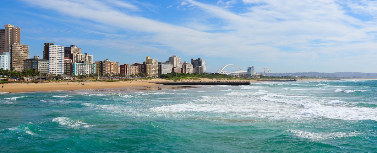 Panoramic view of Durban's "Golden Mile" beachfront as seen from from the Indian Ocean with waves, KwaZulu-Natal province of South Africa