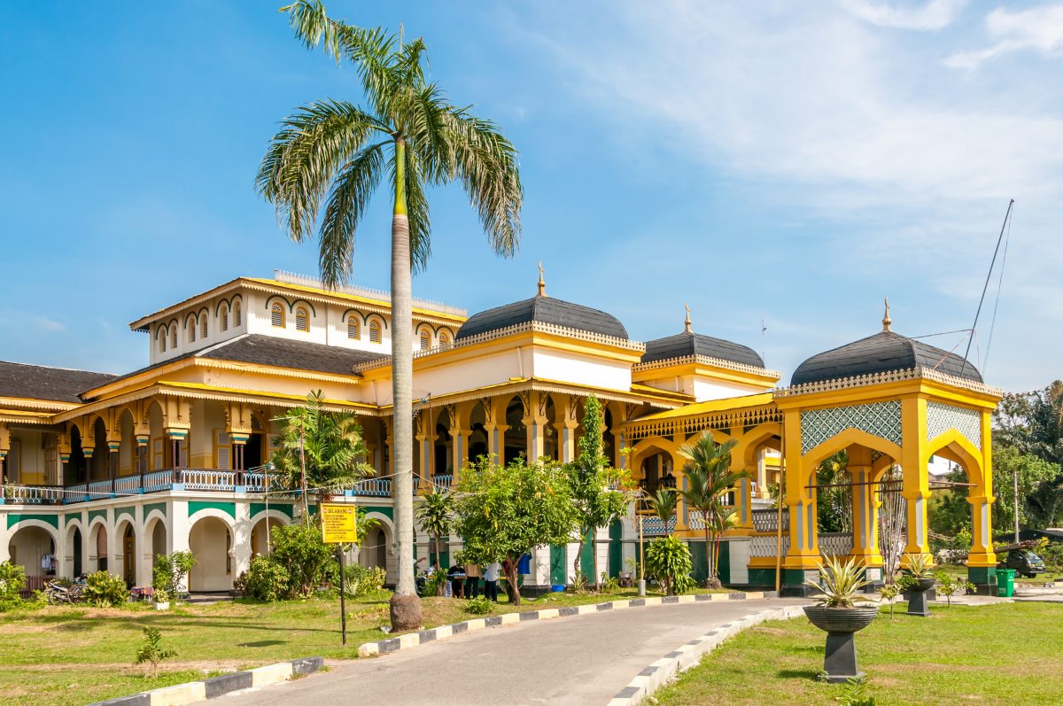 the yellow and white themed Sultan's Palace Maimoon in Medan