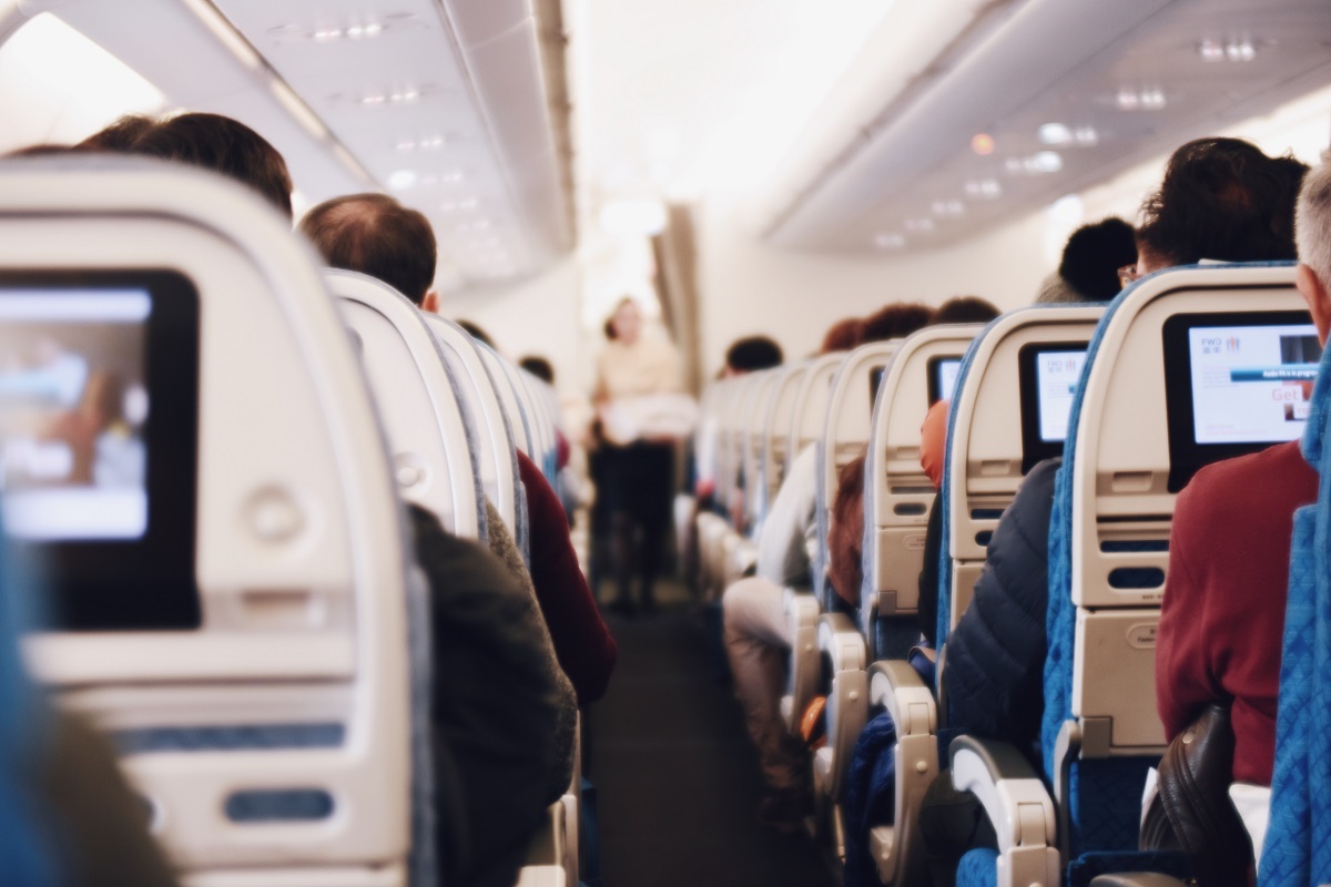 Shallow focus photography of people traveling inside of passenger plane