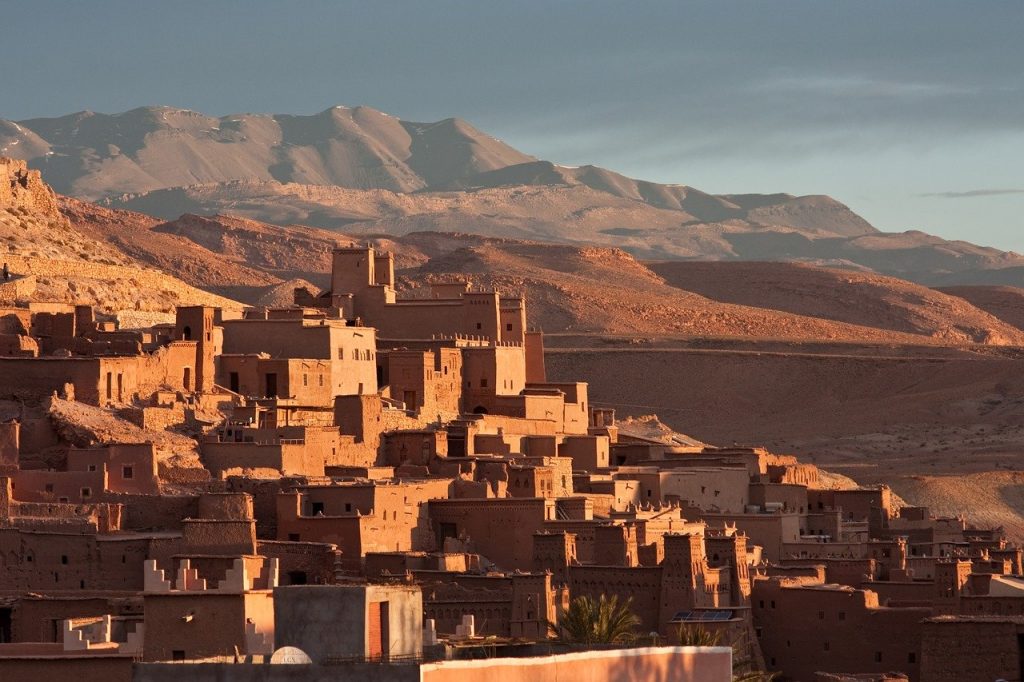 View of Ait Ben Haddou with mountain range backdrop