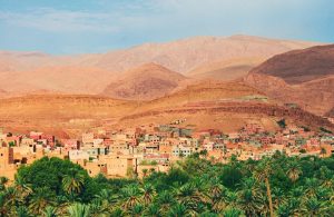 Aerial view of a Moroccan city with desert backdrop