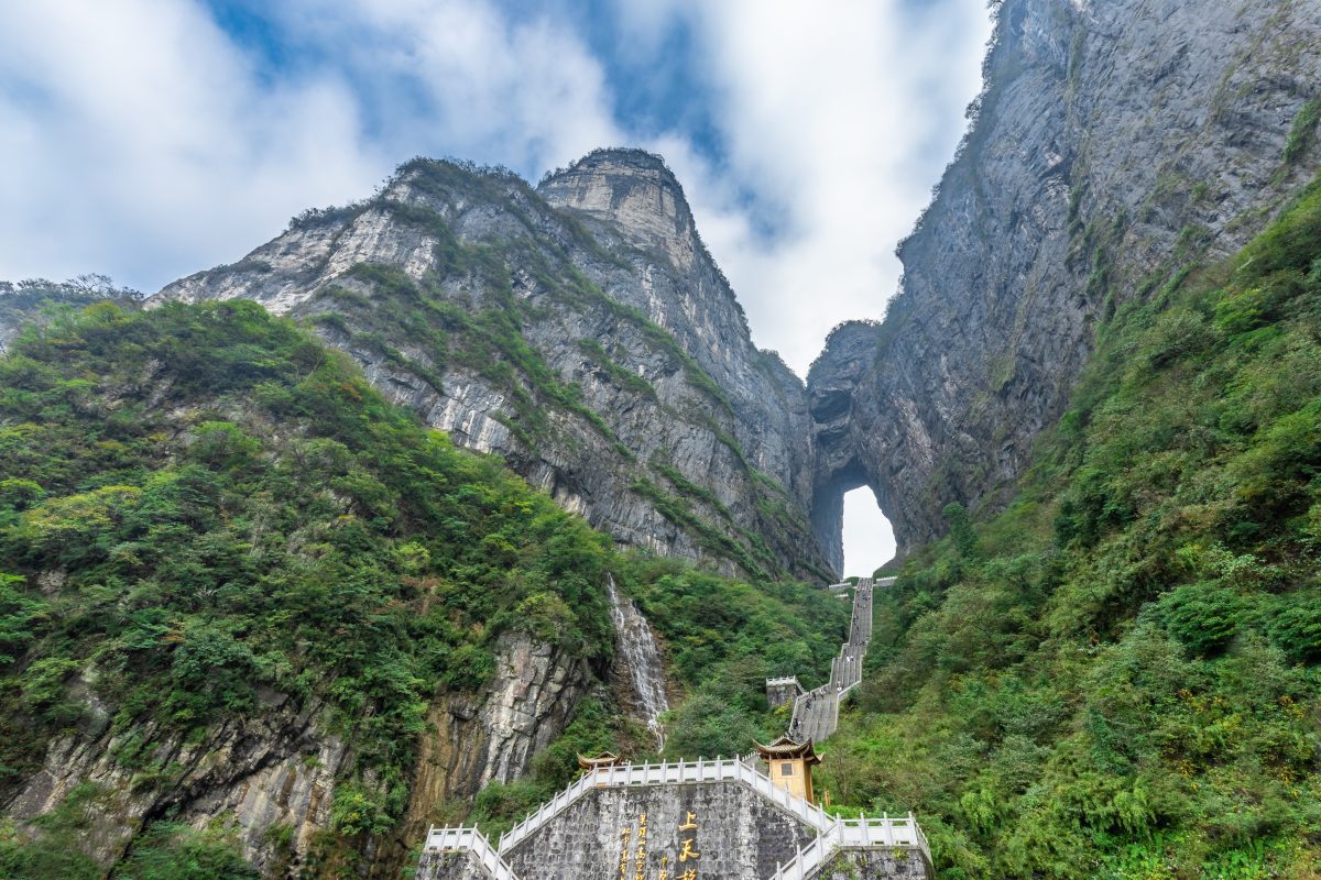 Landscape of The Heaven's Gate of Tianmen Mountain National Park with 999 step stairway on a cloudy day with blue sky, Zhangjiagie, Changsha, Hunan, China