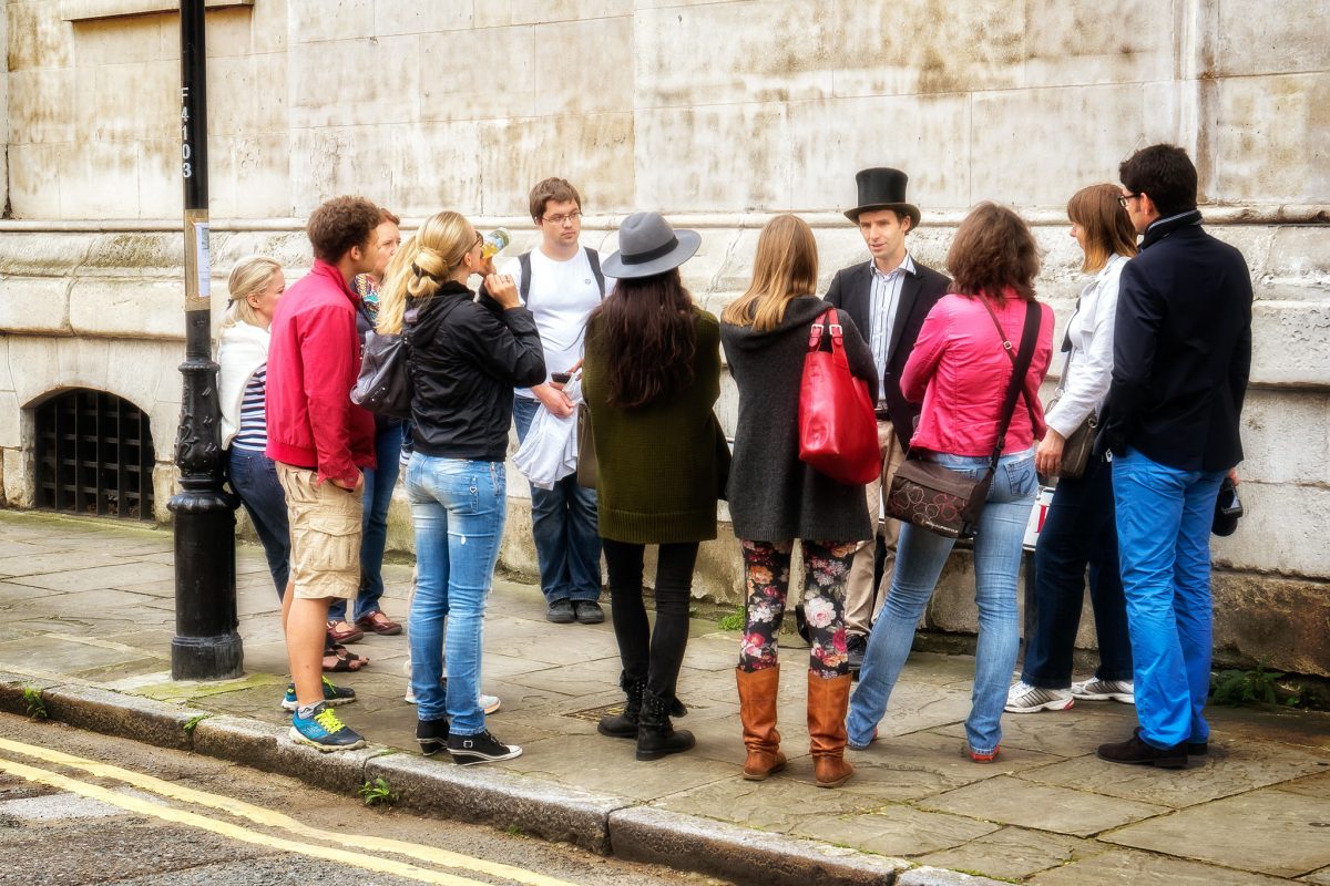 A top-hatted tour guide in London, UK