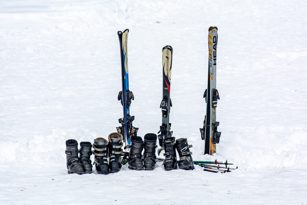 skiing shoes and snow board on snowy ski slopes