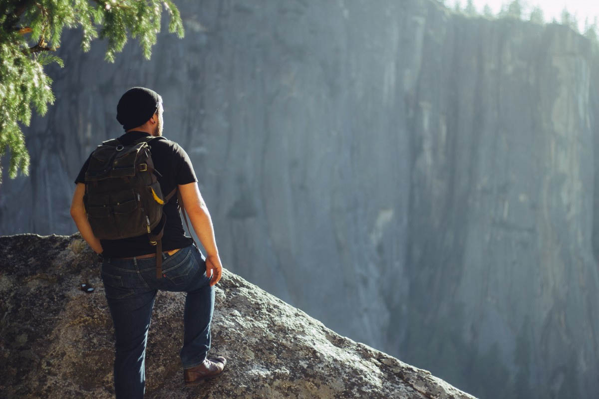 photo of a beginner hiker looking out at the view photo of a beginner hiker looking out at the view