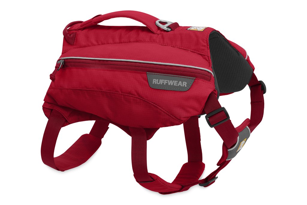 Photo of the red Singletrak Pack in its side view with a dark grey interior and straps along the bottom with a handle on top Photo of the red Singletrak Pack in its side view with a dark grey interior and straps along the bottom with a handle on top