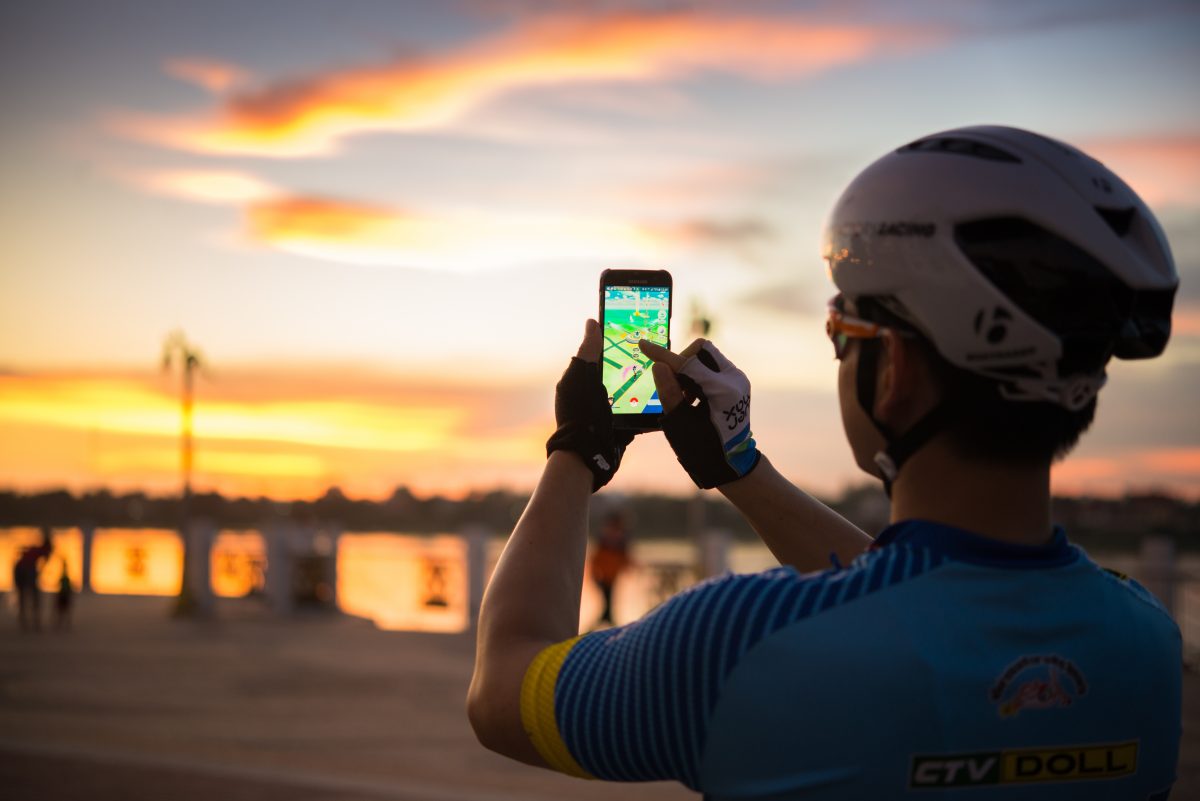 Pokémon hunting on a bike during sunset Pokémon hunting on a bike during sunset