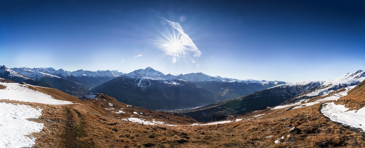 French Alps sun shining brightly on the snow-covered mountains of the French Alps