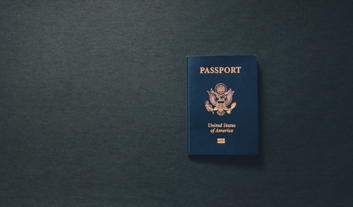 Photo of a Blue United States of America Passport on a dark grey surface