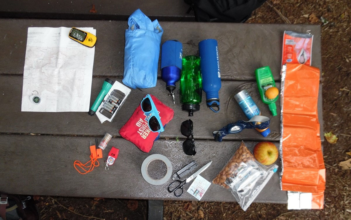 a photo showing all hiking essentials on a table a photo showing all hiking essentials on a table