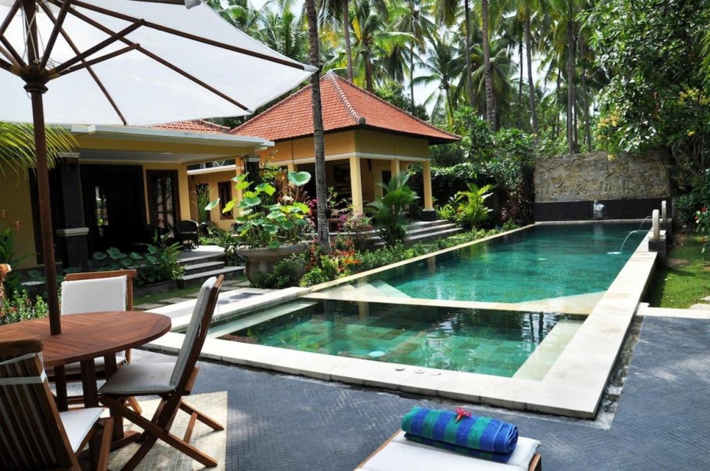 Villas facing the pool surrounded by the jungle at Bali Au Naturel, one the best nude resorts in Bali, Indonesia