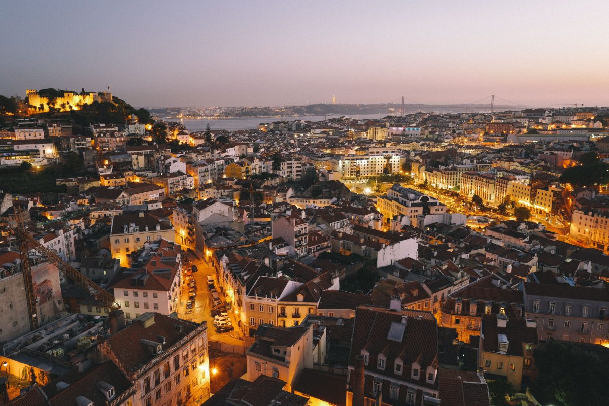 An aerial nighttime shot of the beautiful city of Lisbon, Portugal