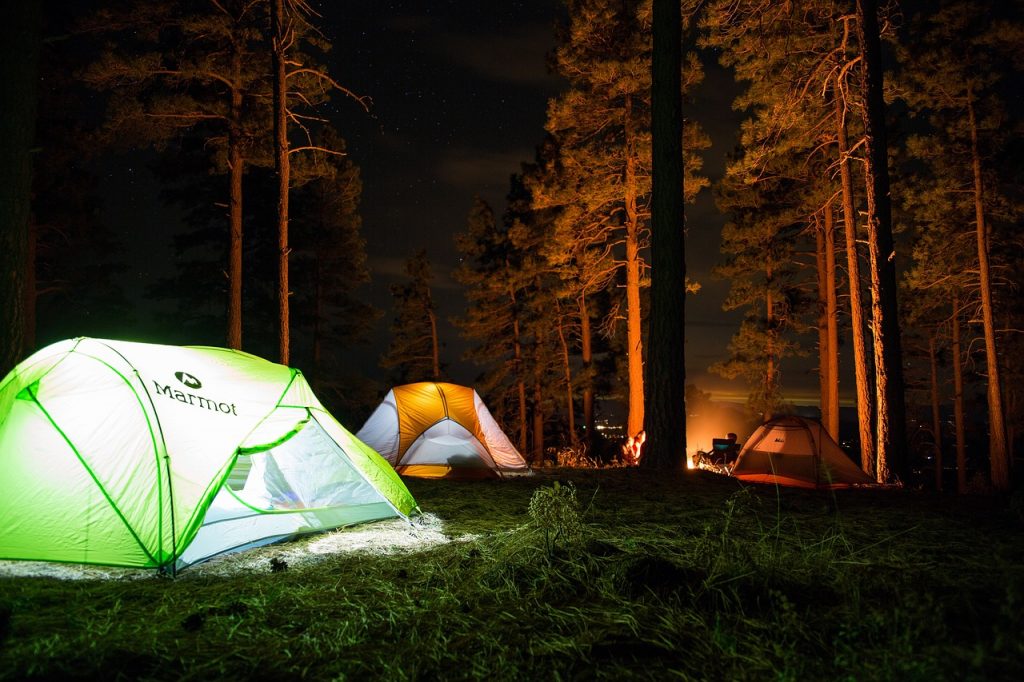 Illuminated tents at night in Sandy Bottoms Resort