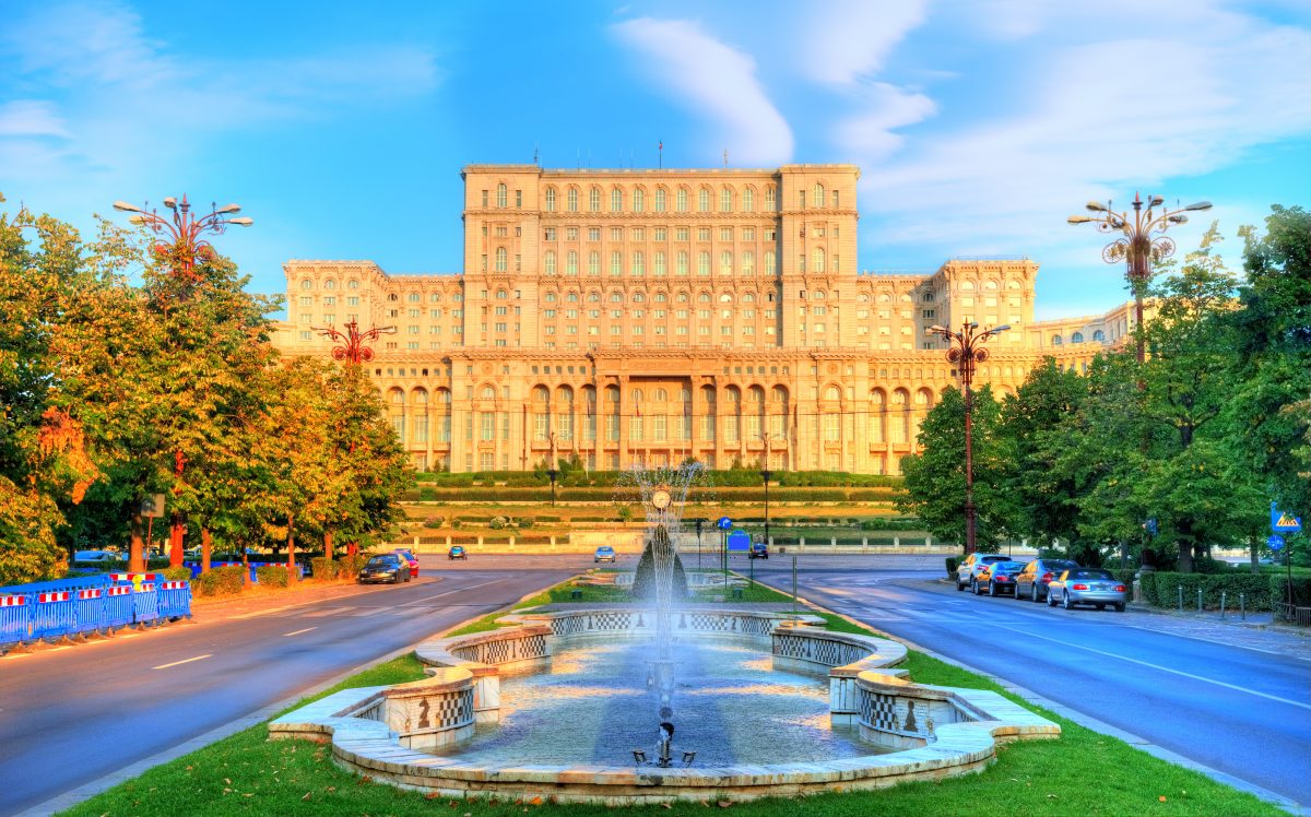 One of the famous and bigest building in the world Palace of Parliament illuminated by sunrise light in the most beautiful place of Bucharest, capital of Romania in Eastern Europe