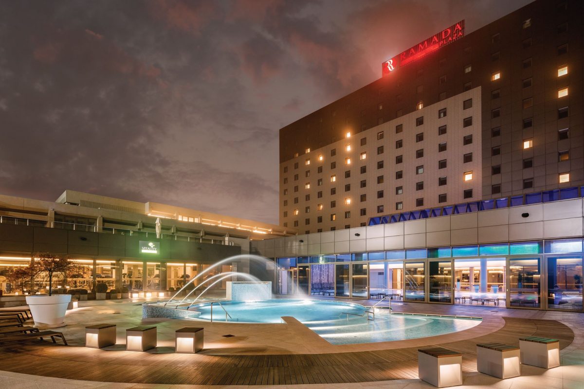 Facade and pool of Ramada Plaza Bucharest