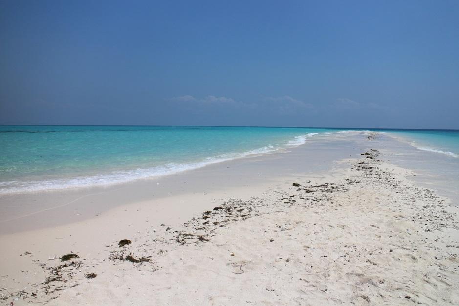 photo of a beach sand lagoon with a clear blue sky photo of a beach sand lagoon with a clear blue sky
