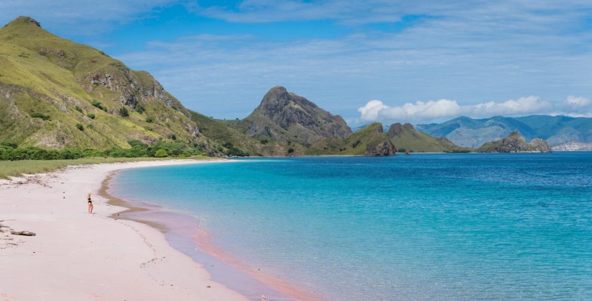 photo of the pink sand where the water meets the shore photo of the pink sand where the water meets the shore