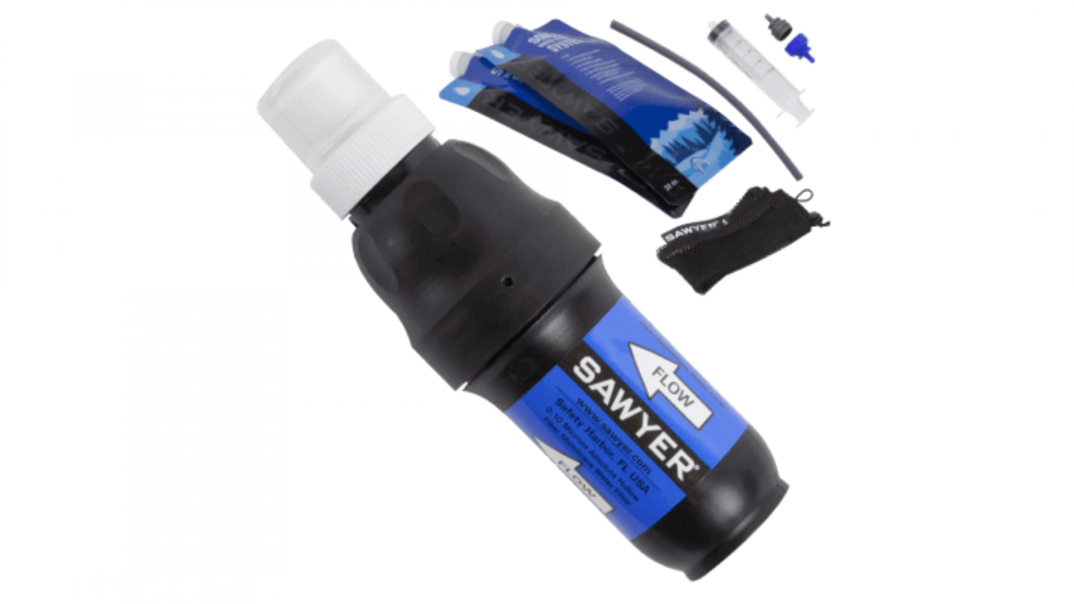 All items included in Sawyer's Squeeze water filtration system laid out against white background