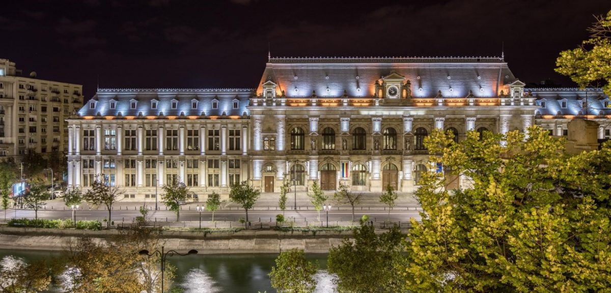 the exterior facade of Concorde Old Bucharest Hotel lit up at night