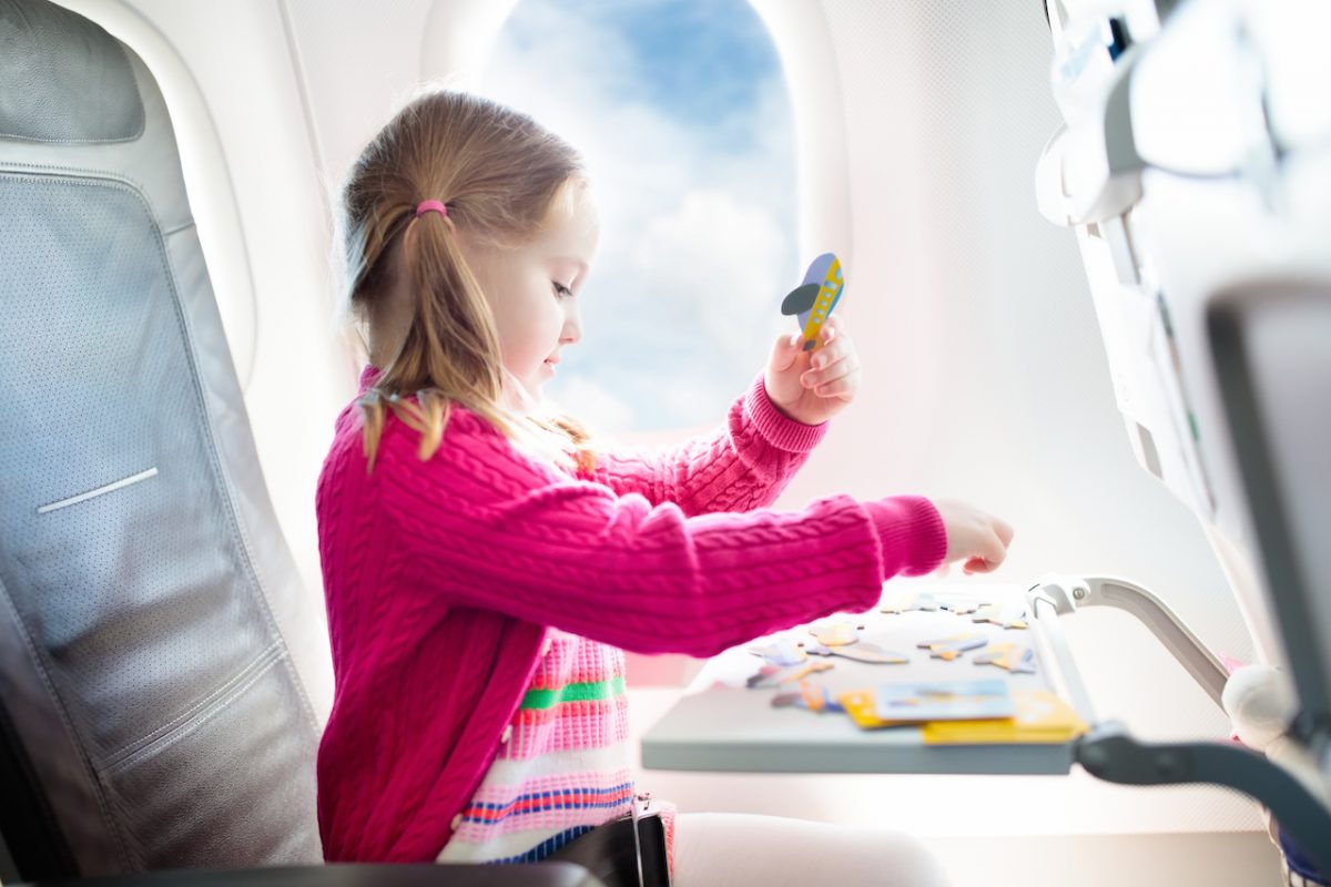 Flying with kids in a plane.