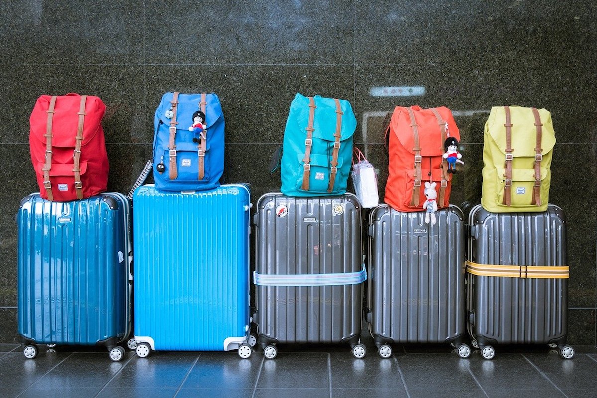 Colorful luggages and carry-on bags lined up