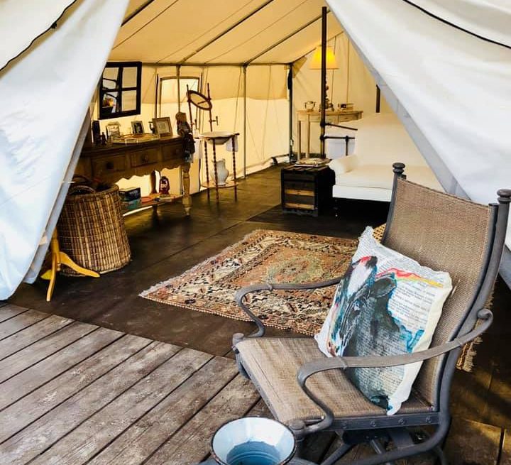 Lounge chair in front of Cedar Ridge's Glamping Tent