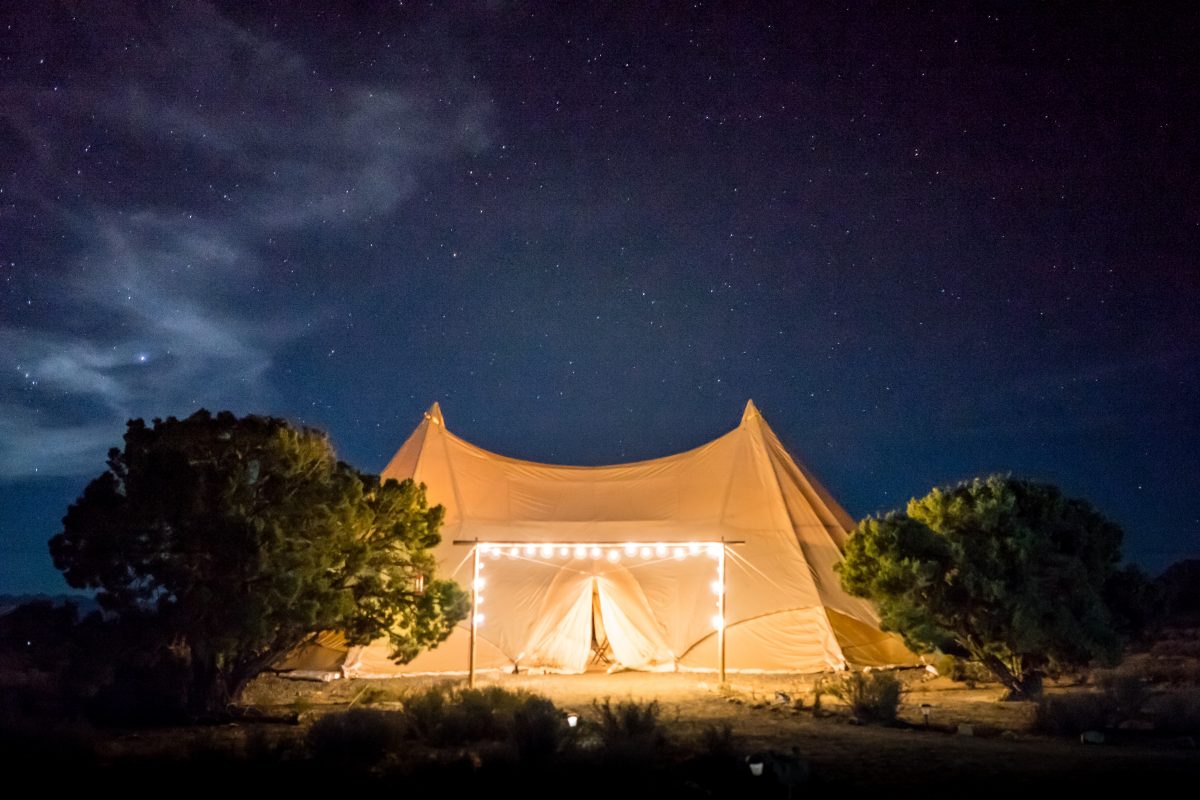 Luxury tent lit up in golden lights Luxury tent lit up in golden lights