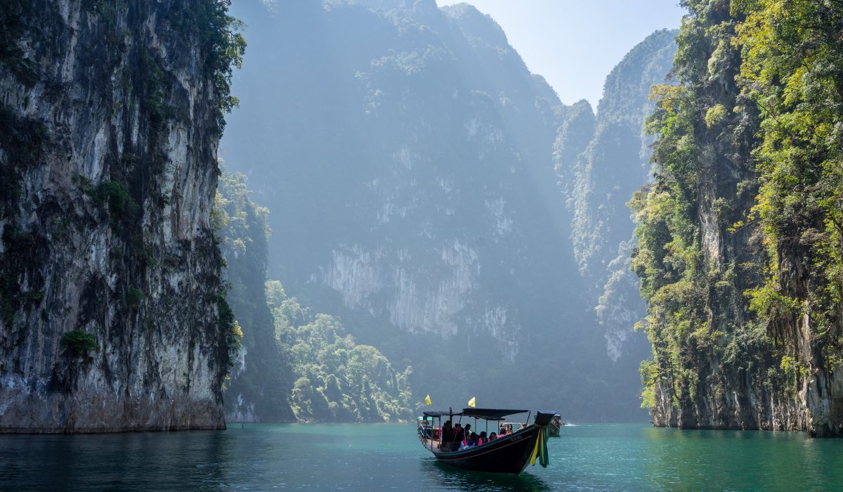 Photo of boat among Thailand's famous limestone formations
