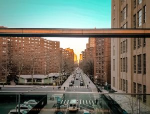 the roads with cars and brown building in New York