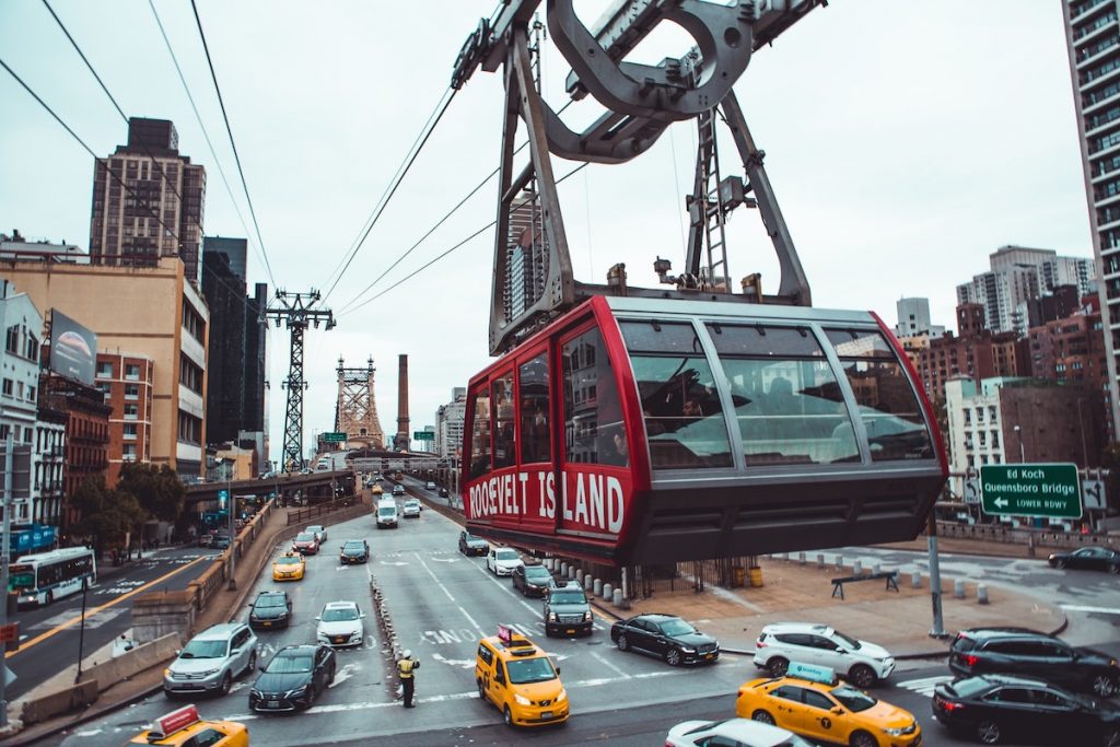 Roosevelt Tram cable car hovering over the city