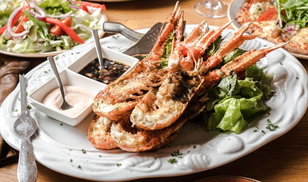 a table with seafood dish a table with seafood dish