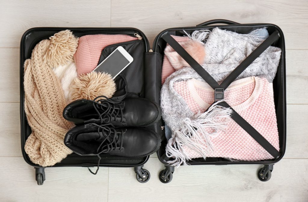 Packed suitcase with clothes