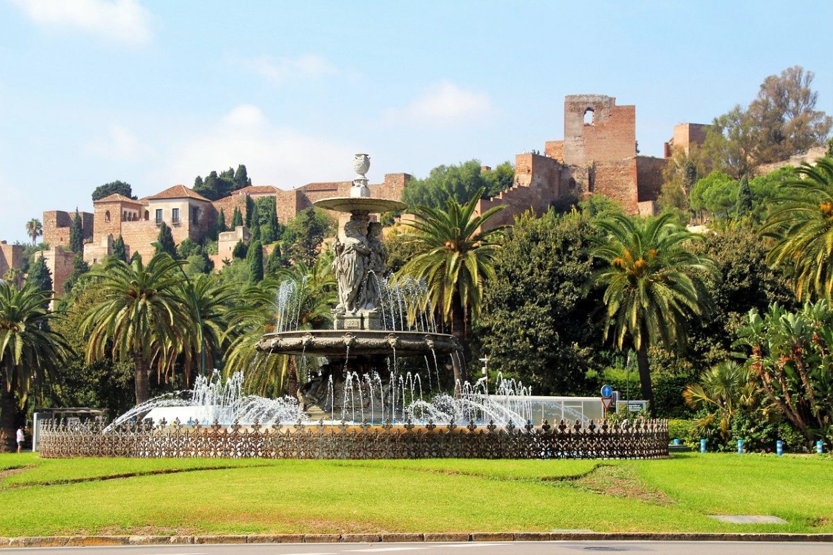 a picturesque palace behind a fountain