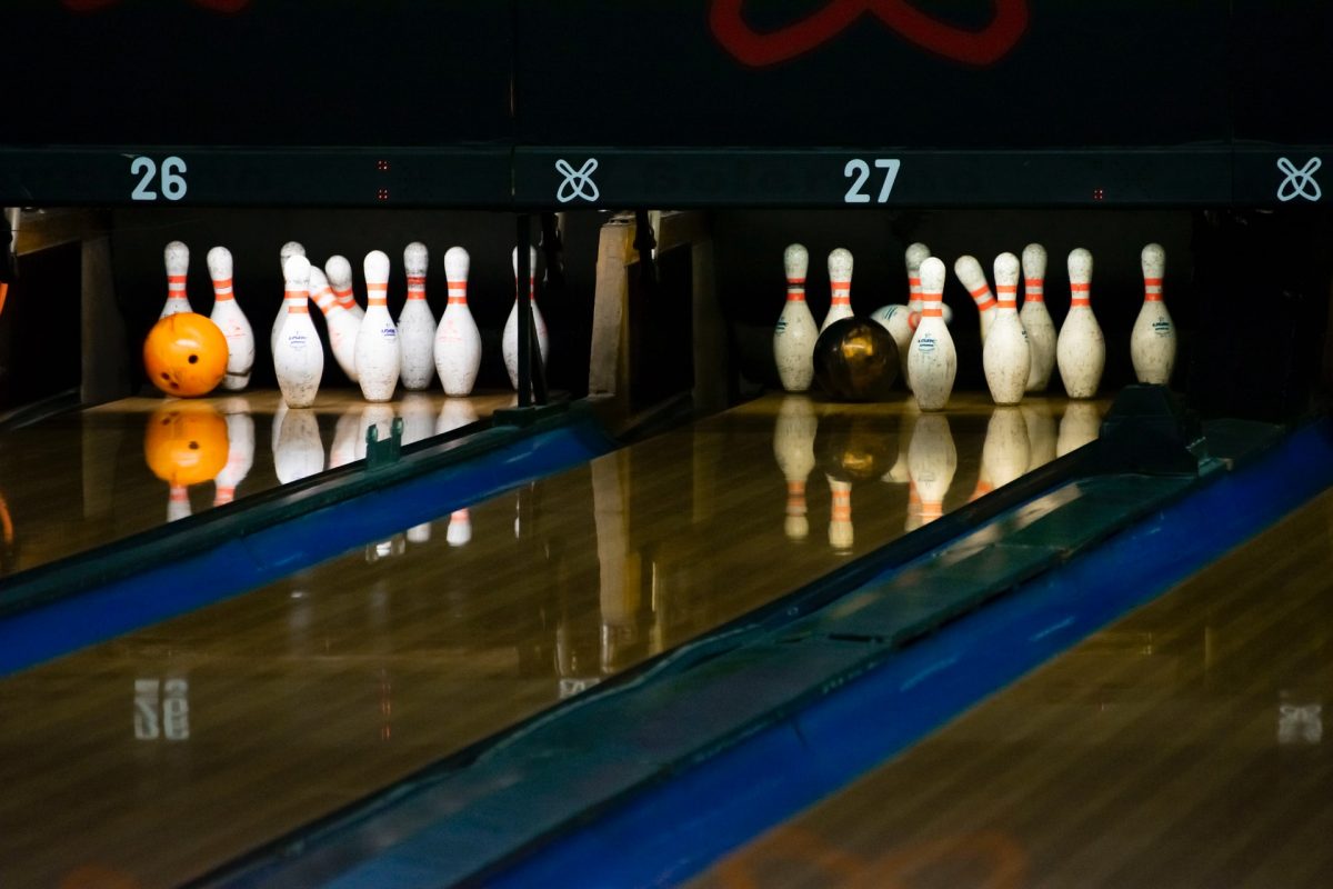 a bowling ball crashing to the pins