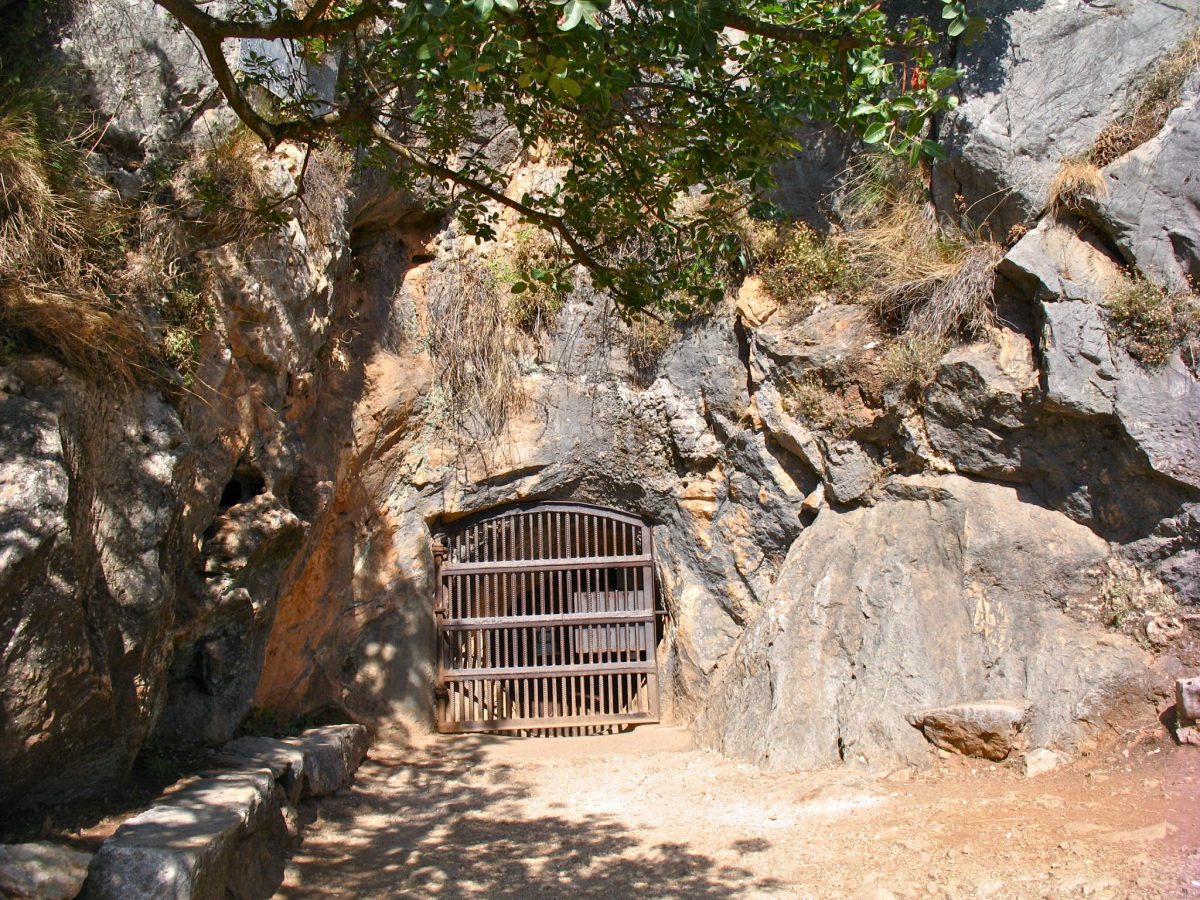 a cave with a gate